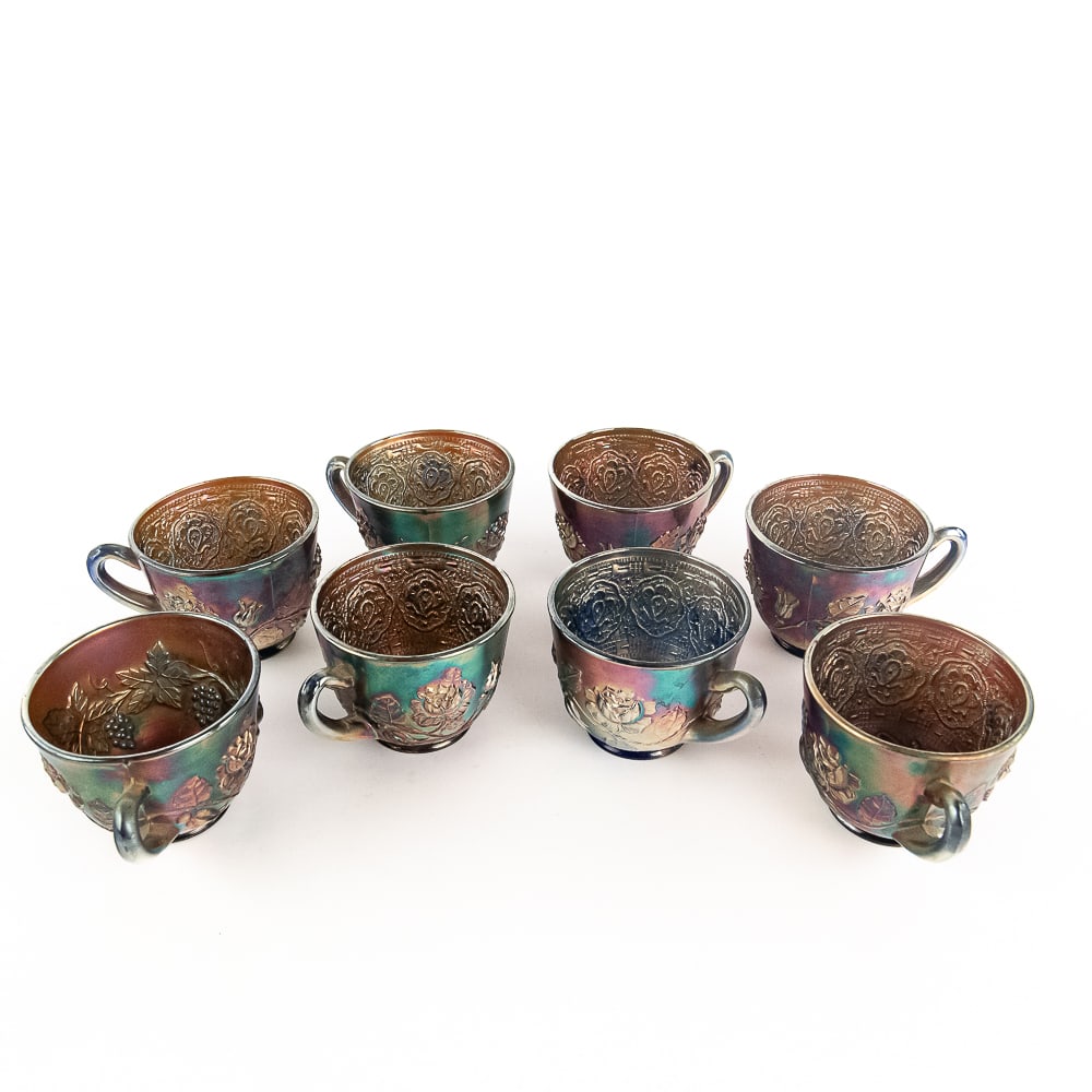 Carnival Fenton Wreath of Roses Cups 8-Pc Lot: Blue. Seven cups feature the Vintage interior and are in good condition. One cup features the Persian Medallion interior and has a chip on the base.See photos to judge condition and bid accordingly.