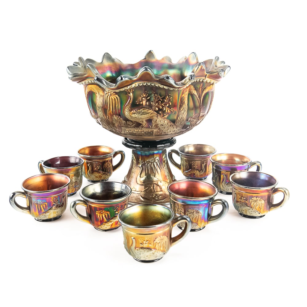 Carnival Northwood Peacock @ Fountain 11-Pc Set: Amethyst purple. The bowl is cracked and missing one flute. Two of the cups have chips. See photos to judge condition and bid accordingly.
