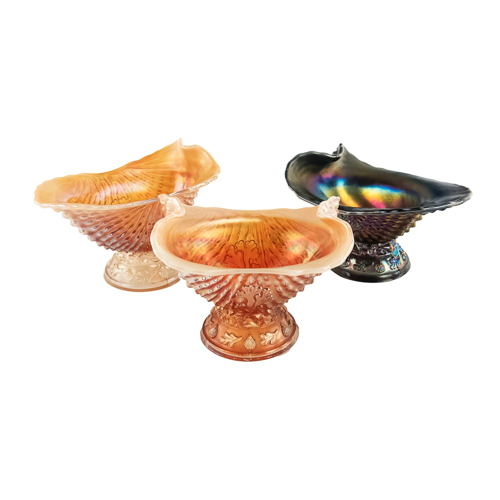 Carnival Glass Dugan Nautilus: 3-Pc Lot: Includes a matching creamer and sugar in peach opal (sugar has a bit of roughness on the base), and a purple creamer with absolutely beautiful iridescence in good condition.See photos to judge conditi
