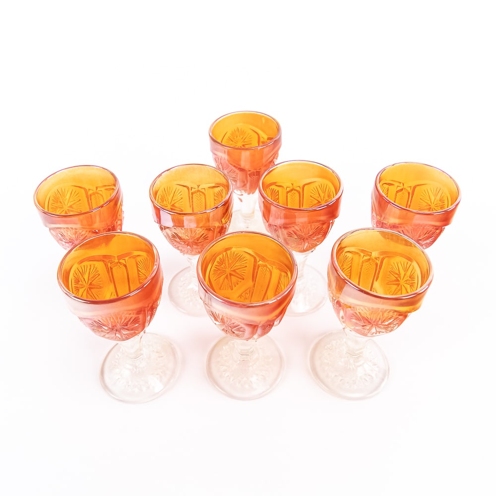 Carnival Glass: Imperial 10-Pc Lot: 10-piece lot of Imperial Star and File in marigold. Includes two decanters (no stoppers) and eight wines (two have chips on the base). See photos to judge condition and bid accordingly.