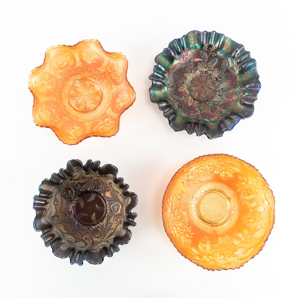 Carnival Glass: Fenton Bowls 4pc Lot: Includes a 9 in. marigold Dragon and Lotus bowl, a 9 in. blue Holly 3-in-1 edge bowl with vivid iridescence, an 8 in. blue Heart and Vine bowl with a 3-in-1 edge, and an 8.5 in. marigold Orange Tree i