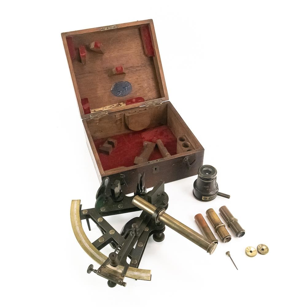 Brass Marine Sextant in Box-Calcutta: This exceptional late 19th to early 20th-century marine sextant exemplifies the precision of British nautical engineering, featuring a handsome brass frame, an inlaid silver or ivory scale, a turned w