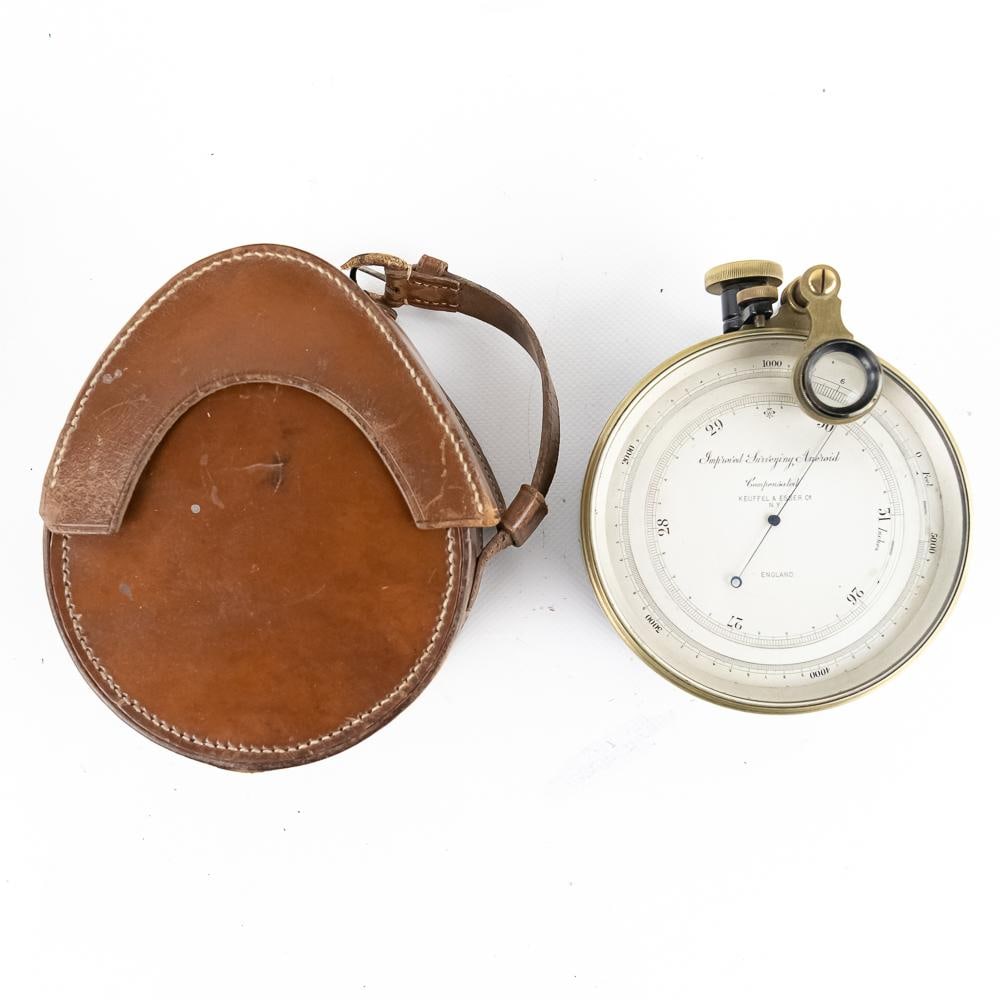 Keuffel & Esser Surveying Aneroid: This professional-grade "Improved Surveying Aneroid" barometer, manufactured for the renowned firm Keuffel & Esser Co. of New York and crafted in England, likely dates to the early 20th century (c.