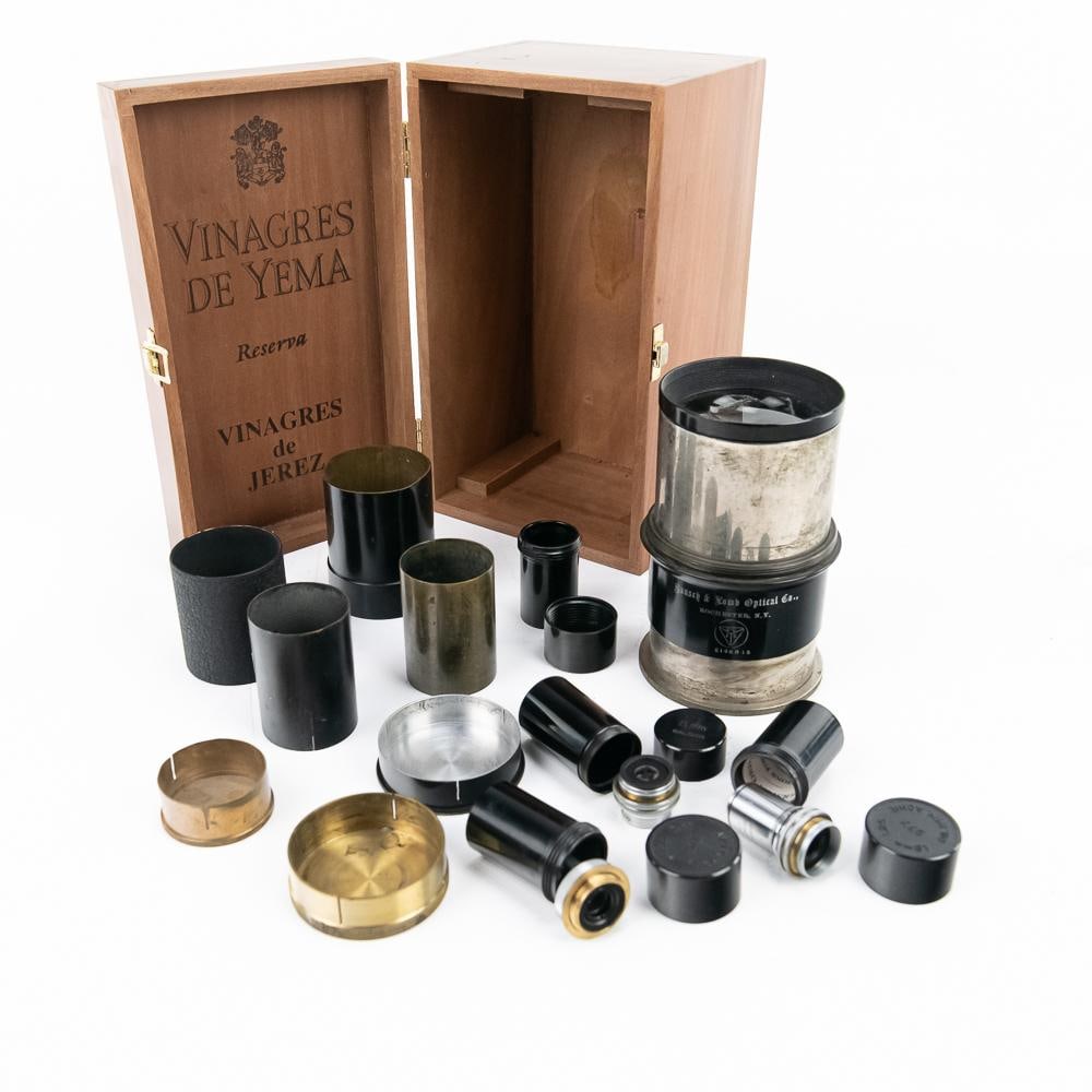 Bausch & Lomb Optical Collection & Lens: This comprehensive collection features vintage scientific optics and accessories from the Bausch & Lomb Optical Co. of Rochester, N.Y. The centerpiece is a large, telescoping clear lens (Serial No.
