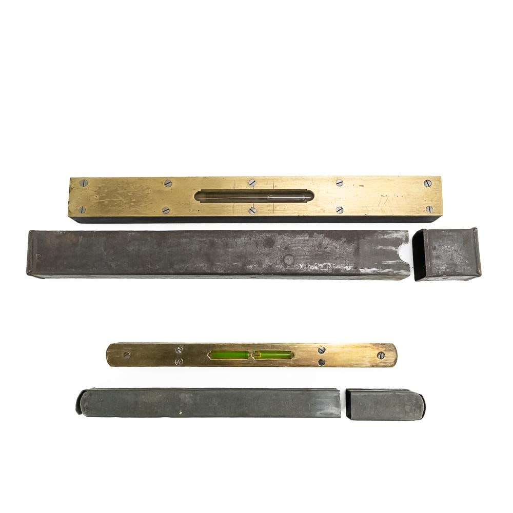 Antique Machinist Precision Inclinometer Pair: This exceptional pair of antique precision machinist spirit levels, complete with their protective metal covers, showcases 19th to early 20th-century American craftsmanship. Both instruments feature