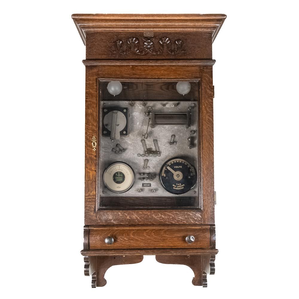 McIntosh Electrotherapeutic Cabinet: Housed in a rich quartersawn oak wall-hanging or tabletop cabinet, this turn-of-the-century electrotherapeutic machine was produced by the McIntosh Battery & Optical Co. of Chicago, Illinois. A