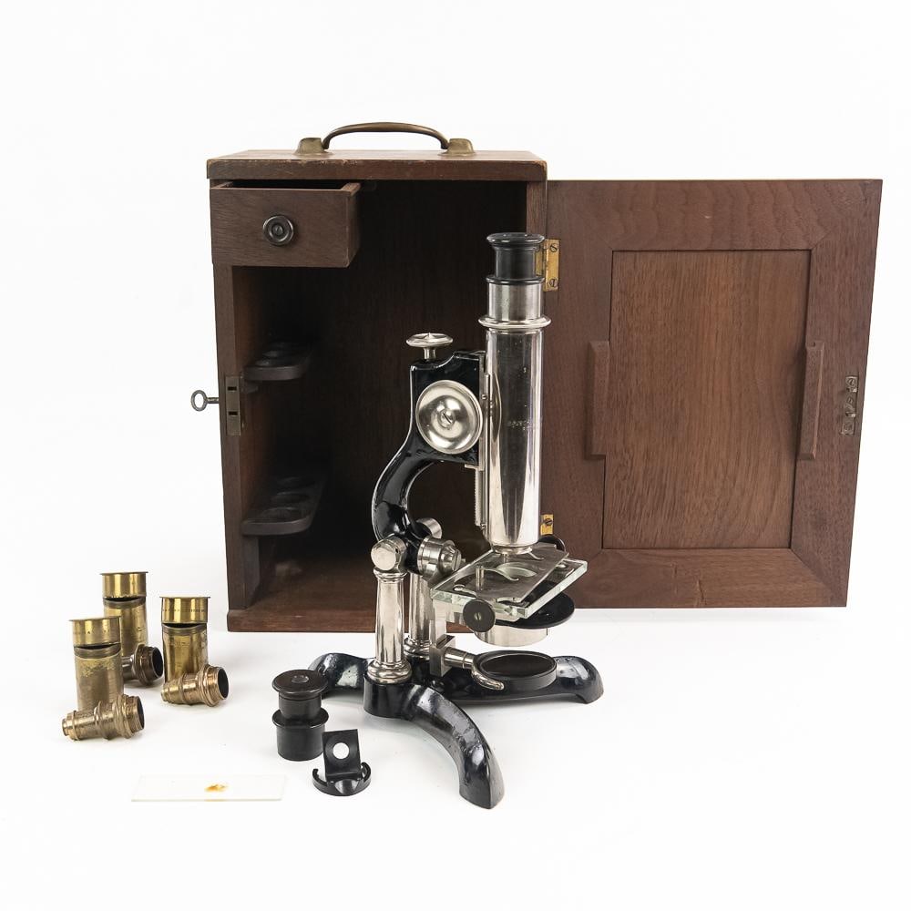 Bausch & Lomb Microscope & Case: This exceptional turn-of-the-century monocular microscope set, crafted by the historic American manufacturer Bausch & Lomb Optical Co. of Rochester, New York, serves as a magnificent testament to