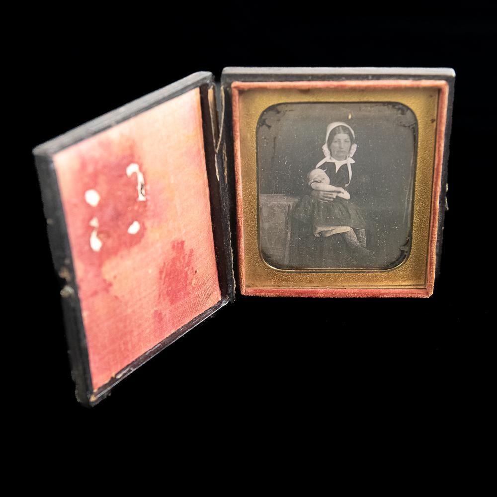 Mother Child Post Mortem Daguerreotype: 1/6 plate post mortem Daguerreotype of a mother with deceased child in her lap. Good clear image under glass and matte. Resealed with archival tape. Mounted in a case with intact hinge. See photos.