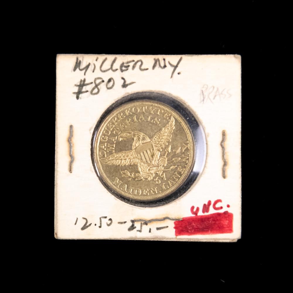 Scovill Brass Daguerreotype Token: Brass token for Scovill Mfg. Co. 57 Maiden Ln., N.Y. makers of Daguerreotype materials. In VG condition with reed edge. Measures 1" diameter. From the Allen Koenigsberg collection.