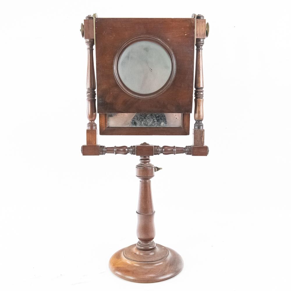 Victorian Tabletop Magnifier & Mirror: Victorian-era turned wood optical table viewer stand featuring a turned central pedestal set on a round base with brass hardware fittings and dual brass adjustment wheels. Craftsmanship indicates
