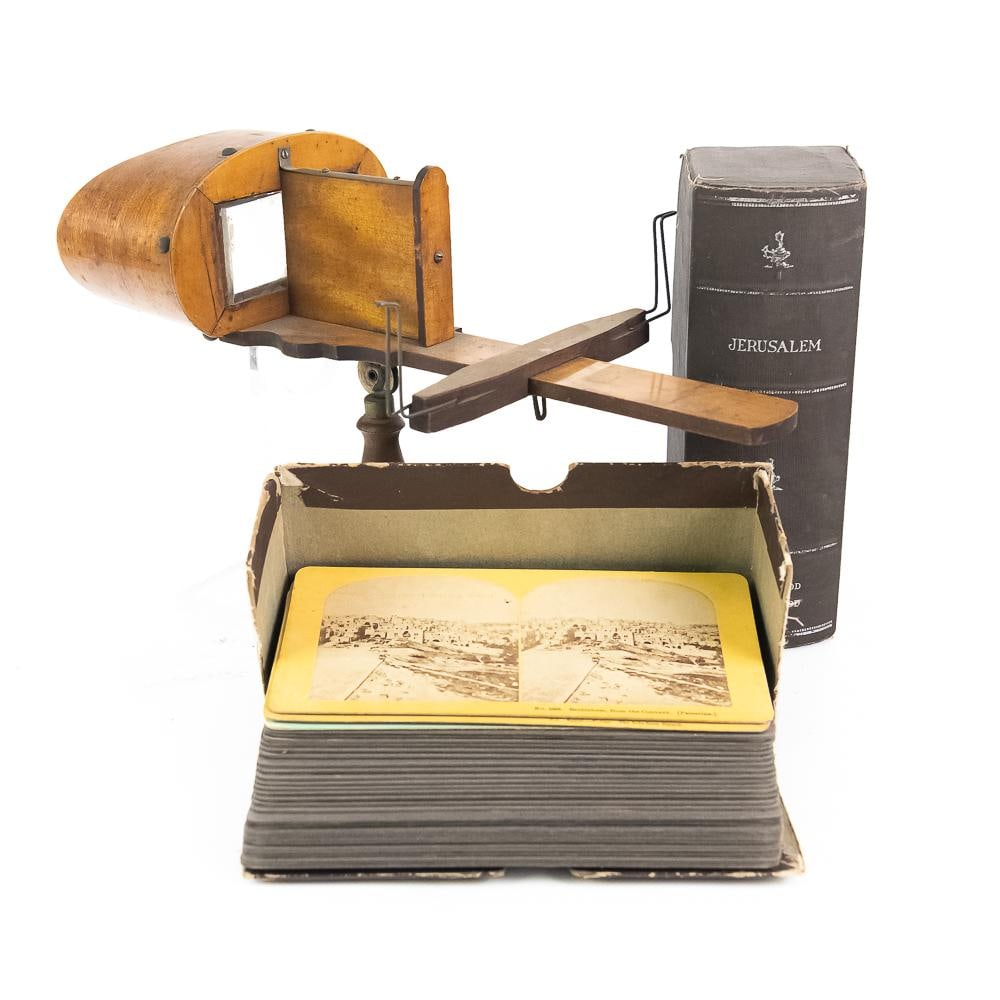 Underwood & Underwood Stereoview Set: This turn-of-the-century Victorian stereoscopic viewer set features a classic wooden handheld stereoscope alongside an original book-form storage box titled "Jerusalem," produced by renowned