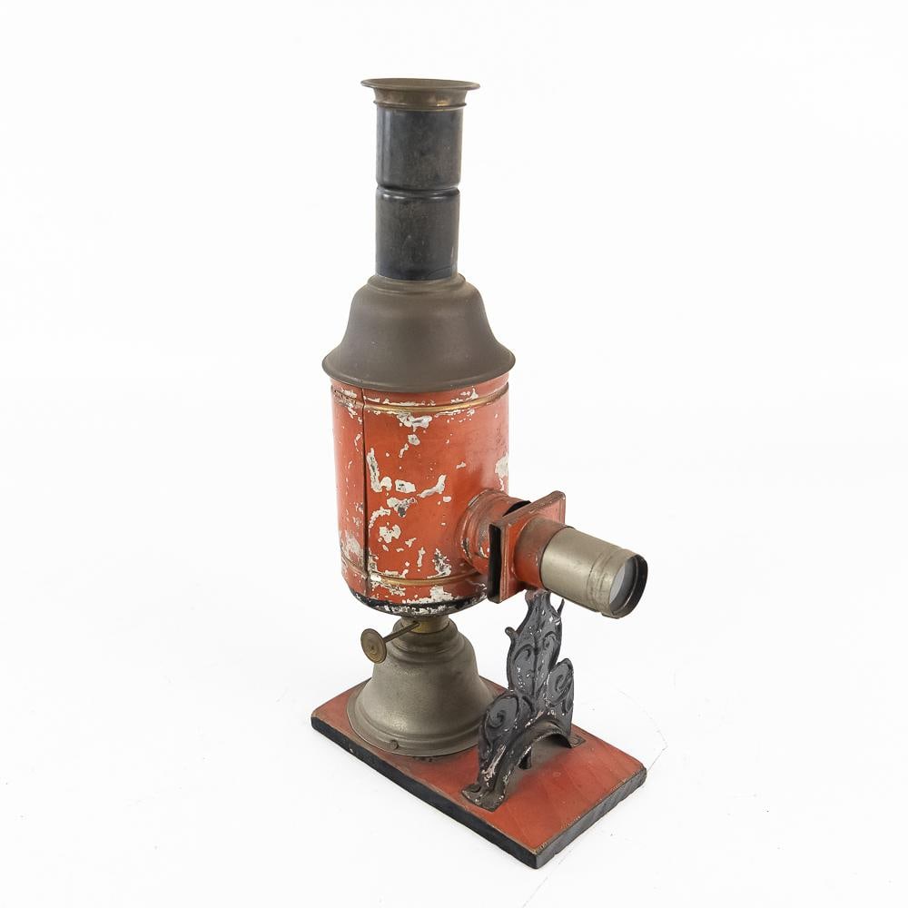 Vintage Toy Magic Lantern: This charming vintage toy magic lantern projector brings the wonder of early home entertainment straight to life, featuring a classic oil-lamp illumination system housed within a bright orange-painted