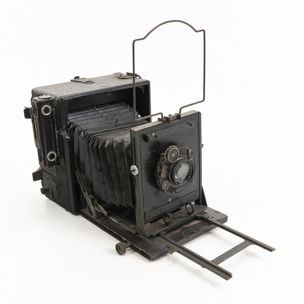 Graflex Speed Graphic Folding Camera: Graflex Speed Graphic folding camera manufactured by The Folmer Graflex Corporation in Rochester, New York. Featuring a leatherette-wrapped wooden and metal body, collapsible bellows, wire frame view 