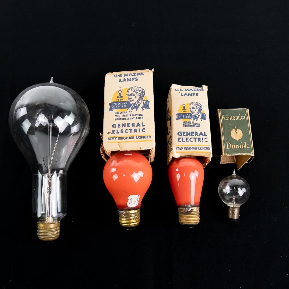 Vintage GE & Westinghouse Mazda Bulb Lot: This vintage collection features four early 20th-century American light bulbs with three original period cardboard packaging boxes, produced by General Electric and Westinghouse McCandless. Included