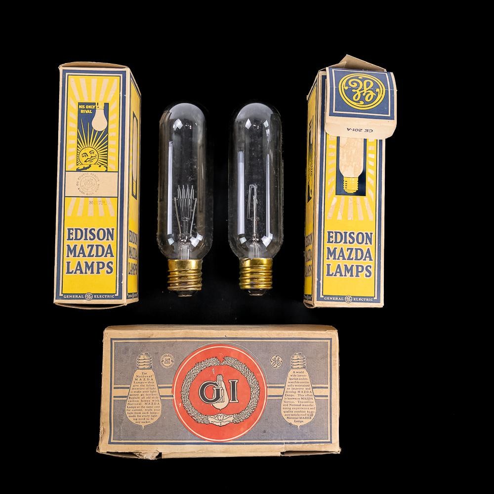 3 Piece Edison Lamp Boxes: One National Mazda box for five 15 watt 116 volt lamps. No lamps. Box in good condition. Dated 1914. Two boxes of Edison Mazda #CE201-A mogul based lamps. Both boxes contain brand new lamps.