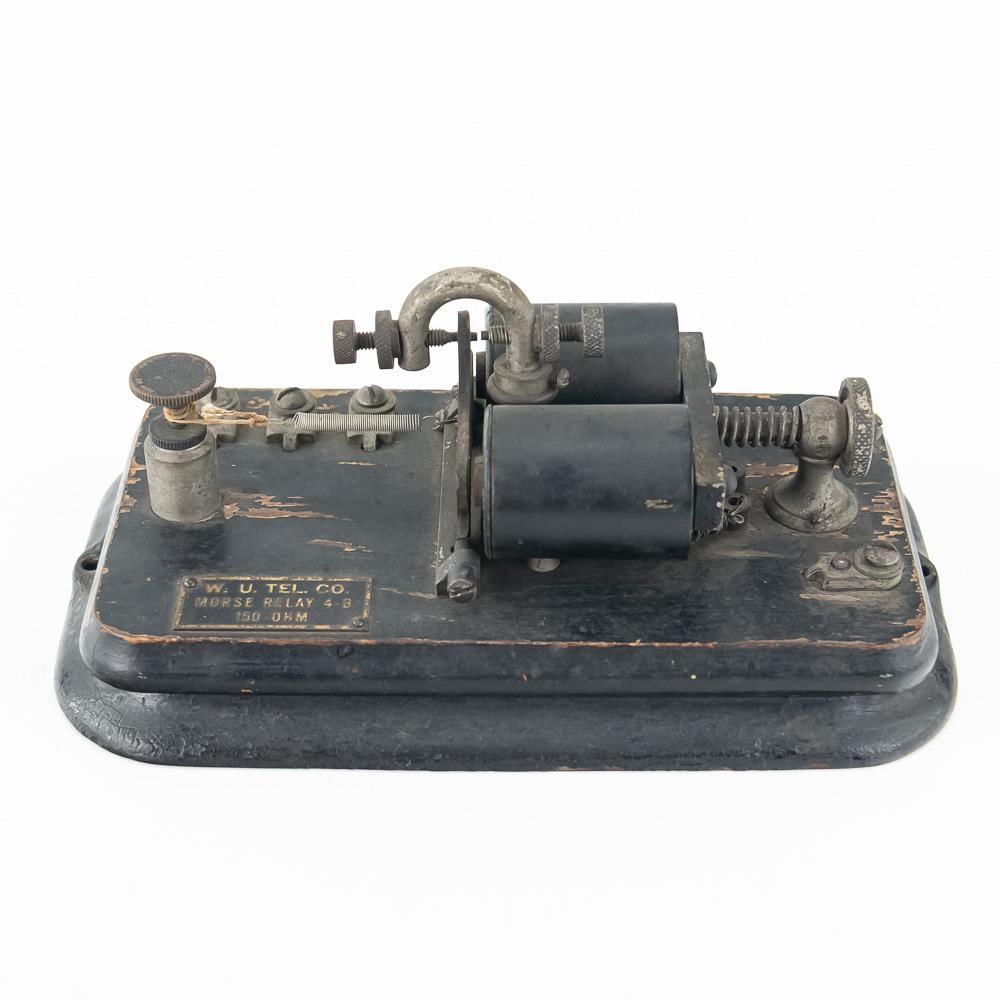 Vintage W. U. Tel. Co. Morse Relay 4-B: This vintage Western Union Telegraph Company Morse Relay Model 4-B featuring a 150-ohm main-line electromagnetic mechanism mounted on a black painted wooden sub-base and cast metal bottom plate stands
