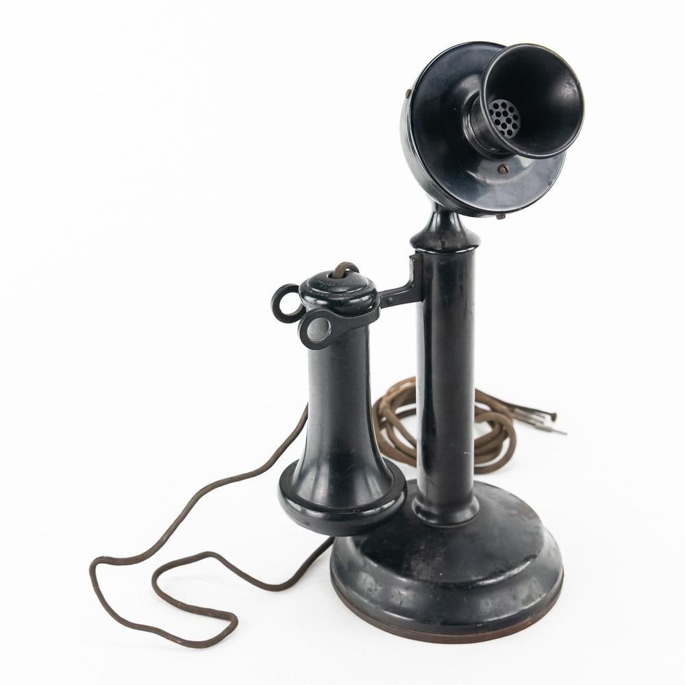 American Electric Candlestick Phone: An early 20th-century American Electric Company upright candlestick desk telephone manufactured in Chicago, Illinois. Constructed with a classic black finish over a heavy steel base and stem,