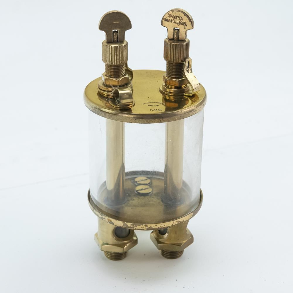 Lunkenheimer No. 5 Brass & Glass Double Drip Oiler: Lunkenheimer No.5 brass double drip oiler with an amazing aged brass and glass body. It is approximately 7" inches tall and the glass cylinder is about 3" inches wide. All glass is intact. In very goo