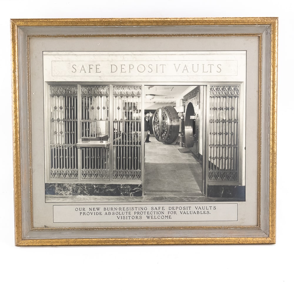 Framed Bank Safe Deposit Vaults Wall Advertisement: An exceptional piece capturing the monumental security architecture of the early 20th century, this framed advertisement features a crisp, custom-matted black-and-white photograph showcasing an intric
