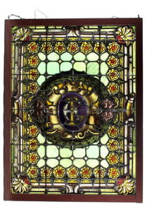 Large 19th Century Stained Glass Window: Sort of Gothic style with stylized letters in center panel and having multi colored panels throughout. With a contemporary frame. Measures 43 1/2 inches high x 32 1/2 inches across. Condition some