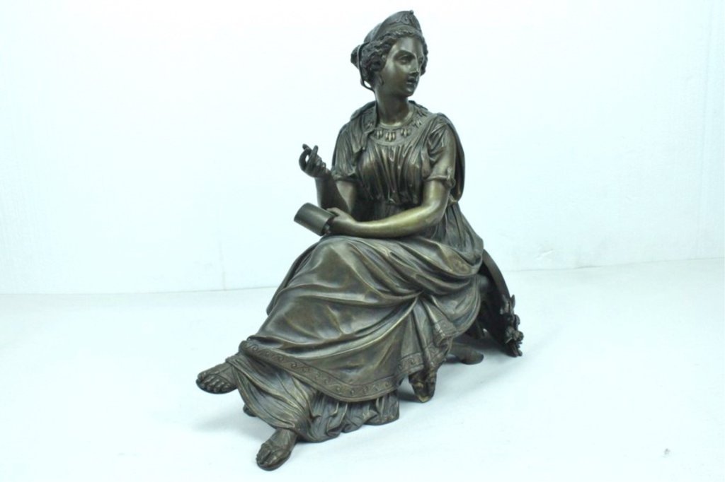 Old Antique Bronze Sculpture Depicting Reclining: Woman on Ancient Greek Style Day Bed. Measures 15 1/2 inches long x 7 inches deep x 15 3/4 inches High. No apparent artist mark. Weight approximately 35 pounds. Condition one bolt replaced that that h