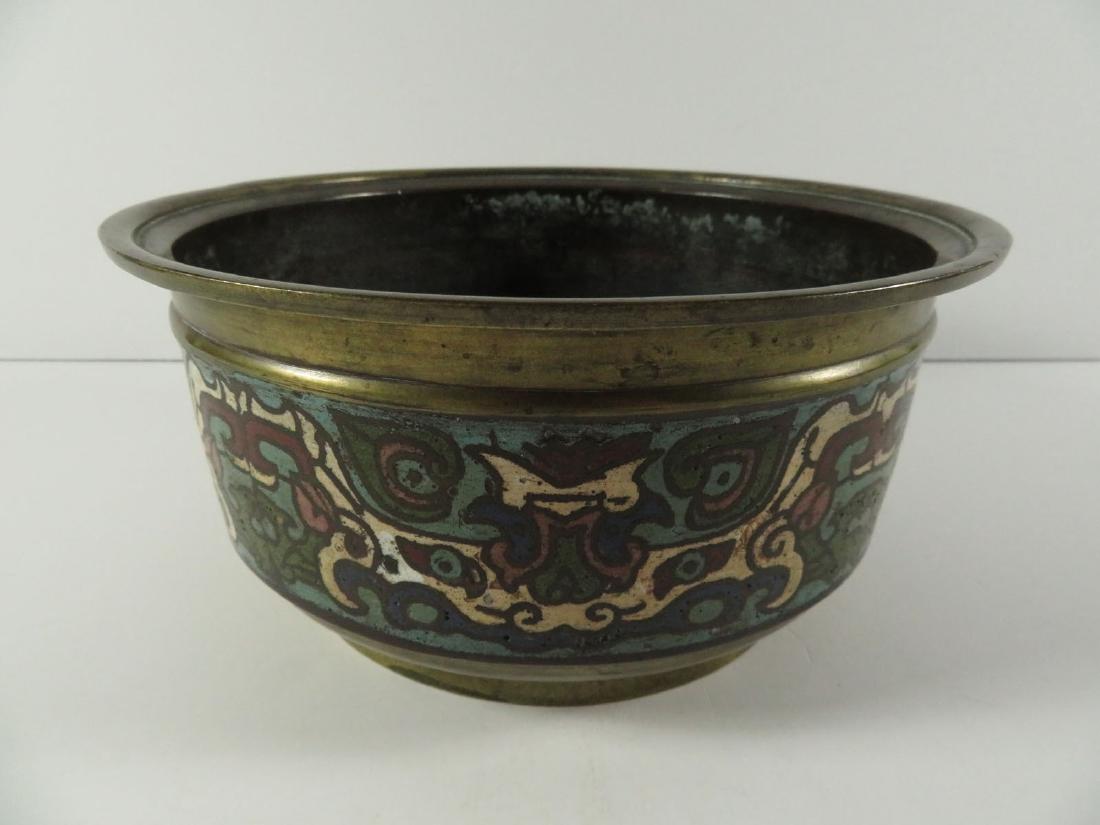 Chinese Champleve Bronze Taotie Mask Bowl: TYPE:Antiques SUB TYPE:Bowl REGION:Asia SUB REGION:China MEDIUM:Bronze SGD/UNS: TITLE:Chinese Champleve Bronze Taotie Mask Bowl CATALOG NOTES:A Chinese bronze bowl with champleve enamel decoration. Ha