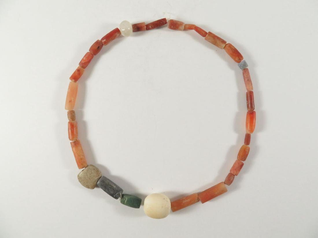 Pre Columbian Necklace Beads Alabaster Pendant: TYPE:Antiques SUB TYPE:Jewelry REGION:South America SUB REGION: MEDIUM: SGD/UNS: TITLE:Pre Columbian Necklace Beads Alabaster Pendant CATALOG NOTES:A Pre Columbian type red stone ? beaded necklace wit