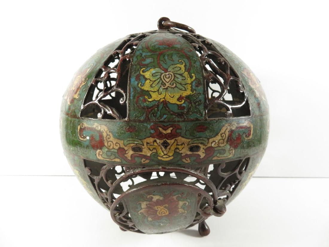 Chinese Bronze Champleve Globular Lantern: TYPE:Antiques SUB TYPE:Lantern REGION:Asia SUB REGION:China MEDIUM:Bronze SGD/UNS: TITLE:Chinese Bronze Champleve Globular Lantern CATALOG NOTES:A Chinese reticulated bronze and champleve enamel hangi