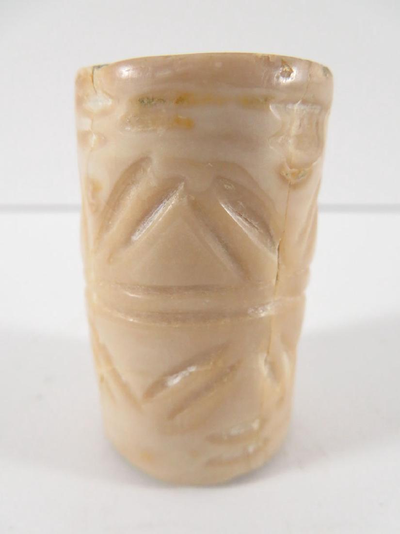 Antique Egyptian Cylinder Seal: TYPE:Antiques SUB TYPE:Seal REGION:Middle East SUB REGION:Egypt MEDIUM:Pottery SGD/UNS:Unsigned TITLE:Antique Egyptian Cylinder Seal CATALOG NOTES:Antique alabaster cyclinder seal with incised decorat