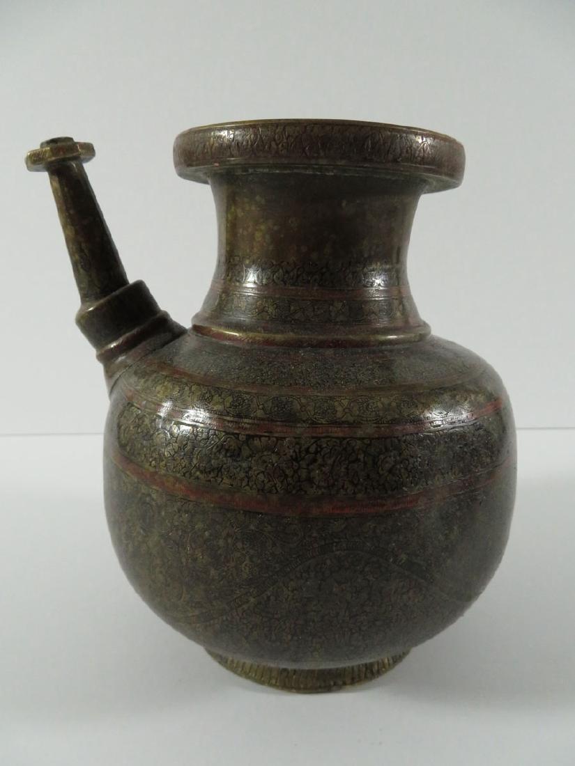 Middle Eastern Etched Bronze Tea Pot (Lamp): TYPE:Antiques SUB TYPE:Tea Pot REGION:Middle East SUB REGION:Persia MEDIUM:Bronze SGD/UNS:Unsigned TITLE:Middle Eastern Etched Bronze Tea Pot (Lamp) CATALOG NOTES:An ornately designed bronze Persian o