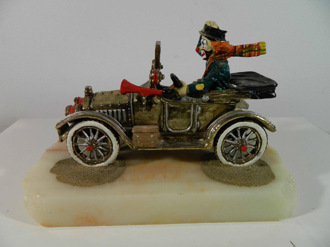 Lot of 7 Clown Related: TYPE:Art SUB TYPE:Sculpture REGION:United States SUB REGION: MEDIUM:Metal SGD/UNS:Sgd TITLE:Lot of 7 Clown Related CATALOG NOTES:A hand painted metal sculpture by world renowned artist Ron Lee. This o