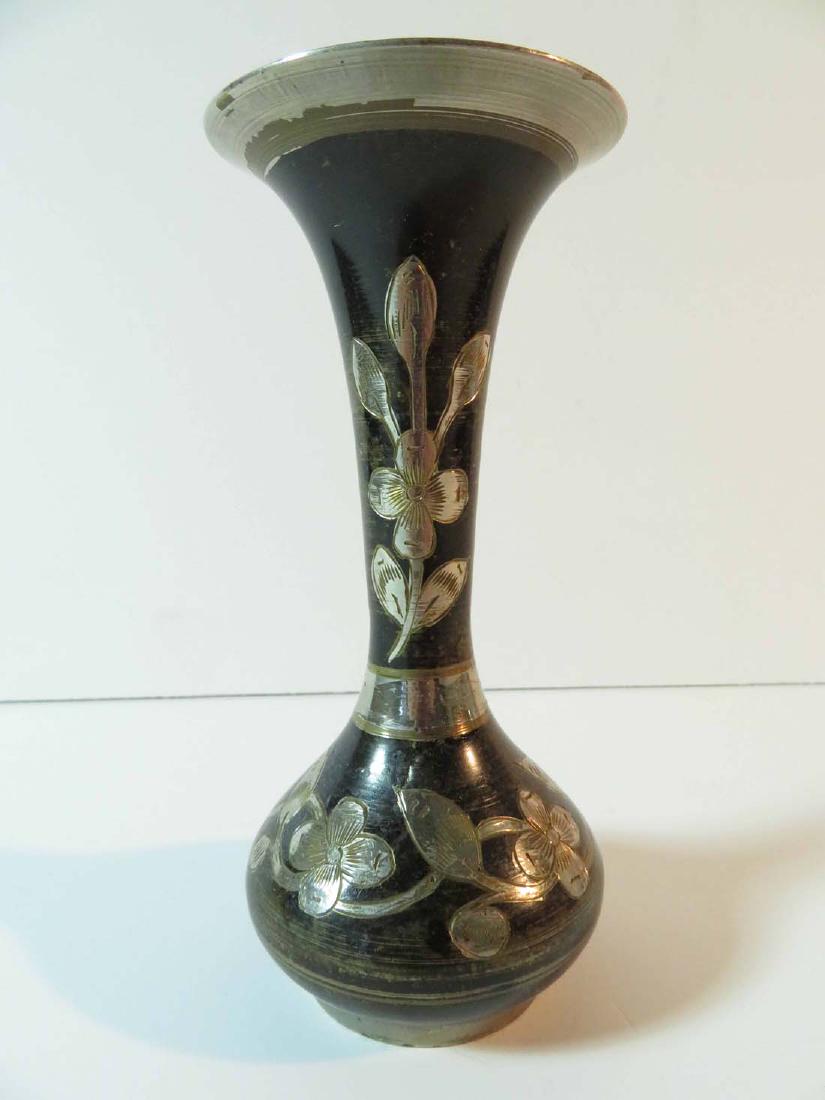 Vase Islamic Silver Inlay Floral On Black: TYPE:Antiques SUB TYPE:Vase REGION:Africa SUB REGION: MEDIUM:Metal SGD/UNS: TITLE:Vase Islamic Silver Inlay Floral On Black CATALOG NOTES:A nice Islamic metal vase with silver floral pattern inlaid on