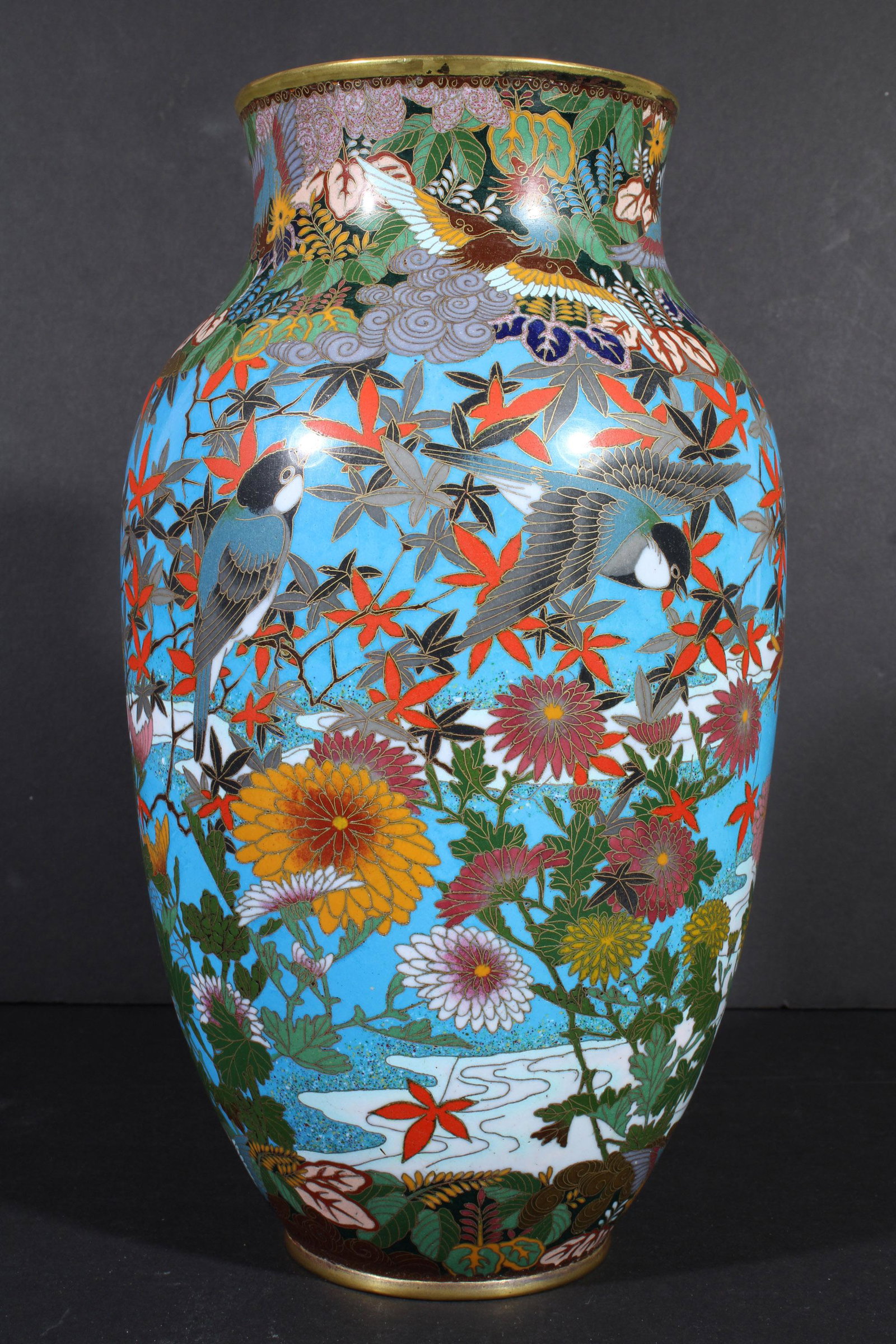 Lg Japanese Cloisonne Vase 12" Sparrow Bird Flower: DESCRIPTION: An intersting and very colorful 12 inch tall Meiji to Taisho era Japanese cloisonne vase. It features sparrows and colorful flowers. Stylized hoho birds are shown in the top and bottom bo