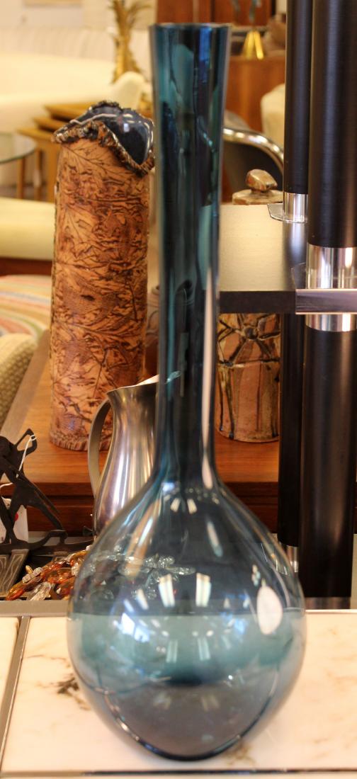 Vintage Tall Skinny Necked Blue Glass Bottle: For your consideration is a tall, skinny necked, blue glass art vase. The dimensions are 6.5" Dia x 19.5" H.