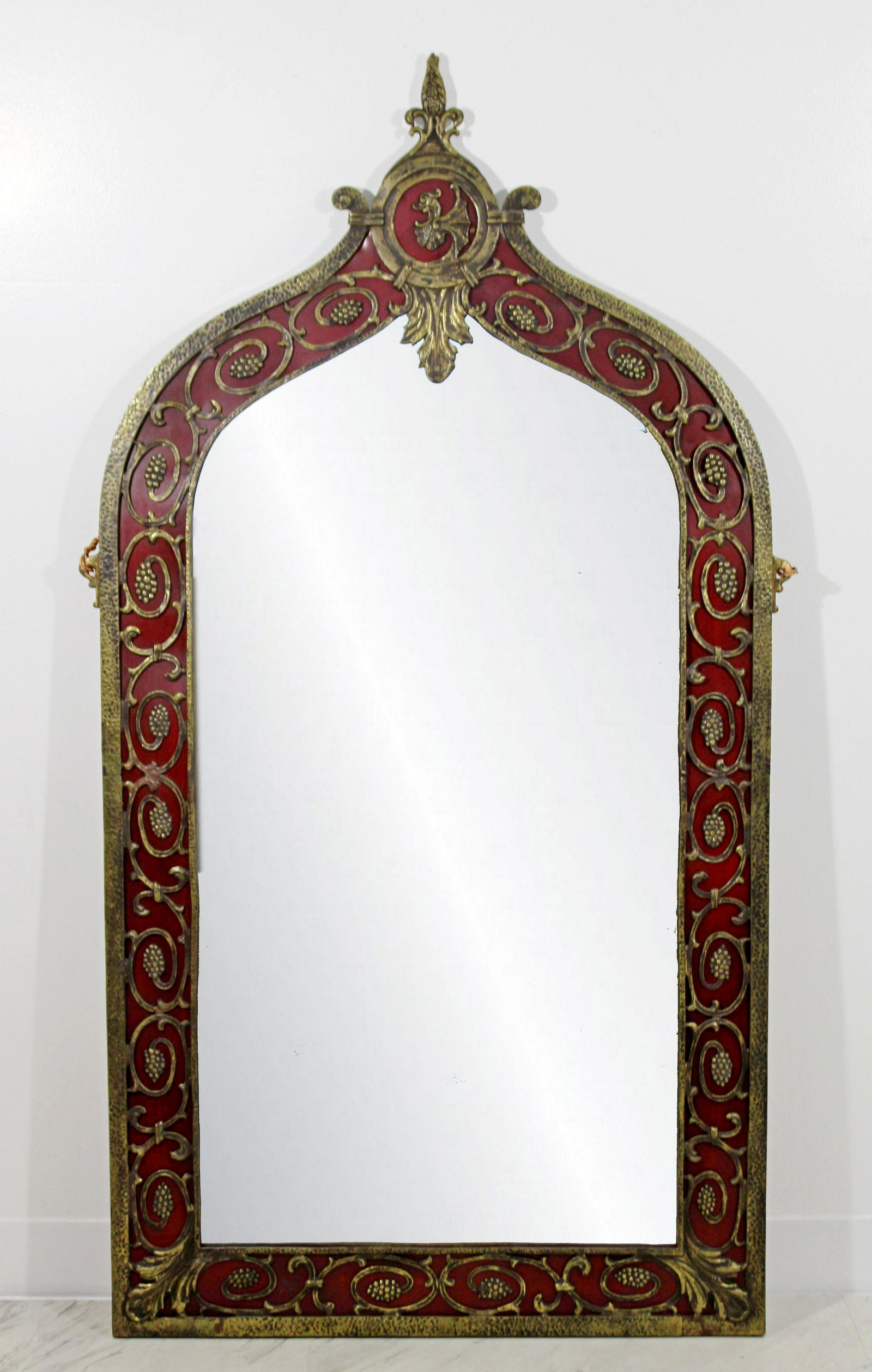 Art Deco Oscar Bach Bronze Red Enameled Wall Mirror: For your consideration is a beautiful, large, ornate bronze wall mirror by Oscar Bach, circa the 1920s. In good condition, with some imperfections in the glass.