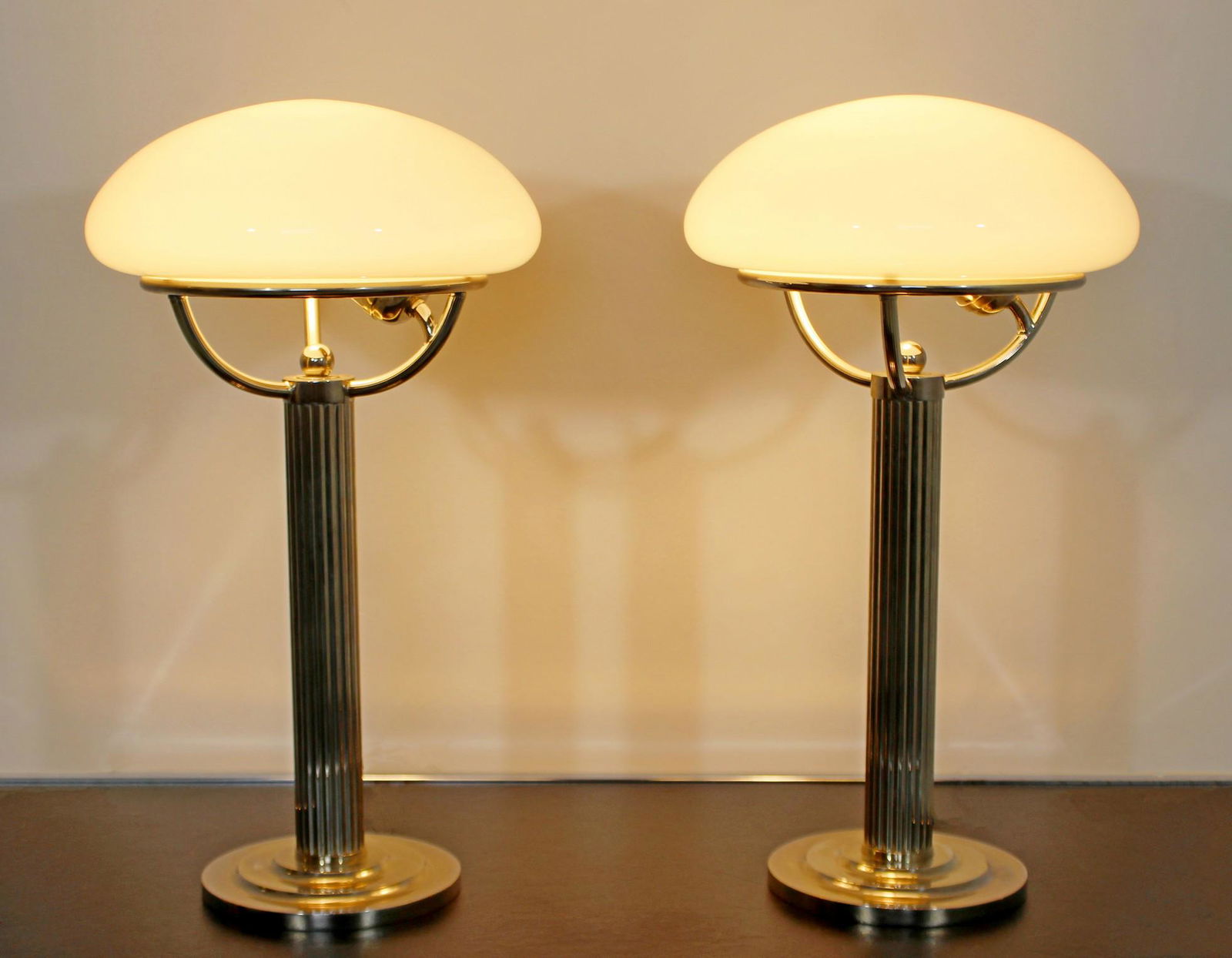 Pair of Adolf Loos Austrian Lamps: For your consideration is a marvelous pair of chrome table lamps, with glass shades, by Adolf Loos, made in Austria, circa 1910. In very good antique condition. The dimensions are 10" Dia x 18" H.