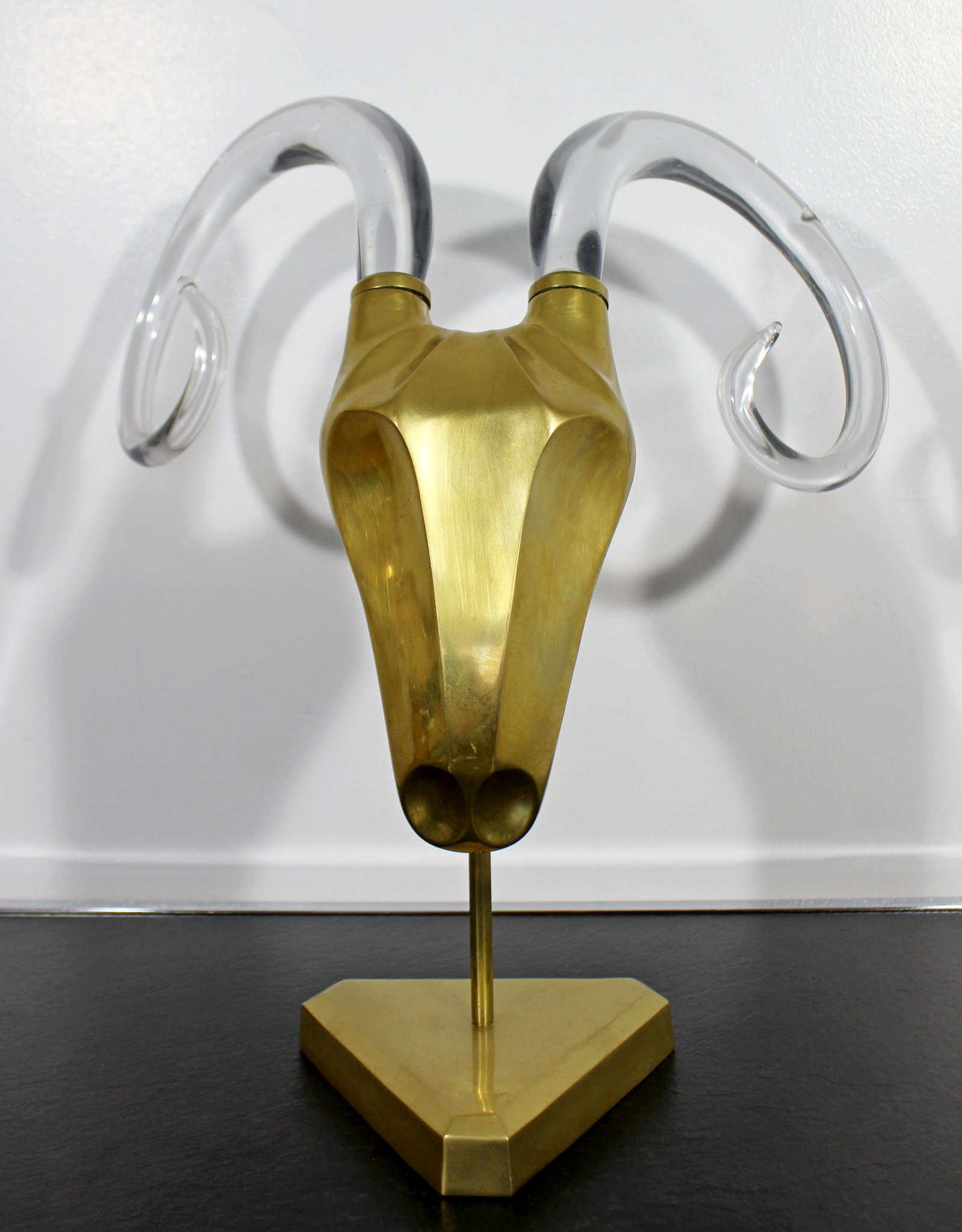 Hollywood Regency Brass Glass Ram Head Table Sculpture: For your consideration is a magnificent, Hollywood Regency table sculpture, of a ram's head in brass, with glass horns, dated 1986. In excellent vintage condition. The dimensions are 16" W x 12" D x 1