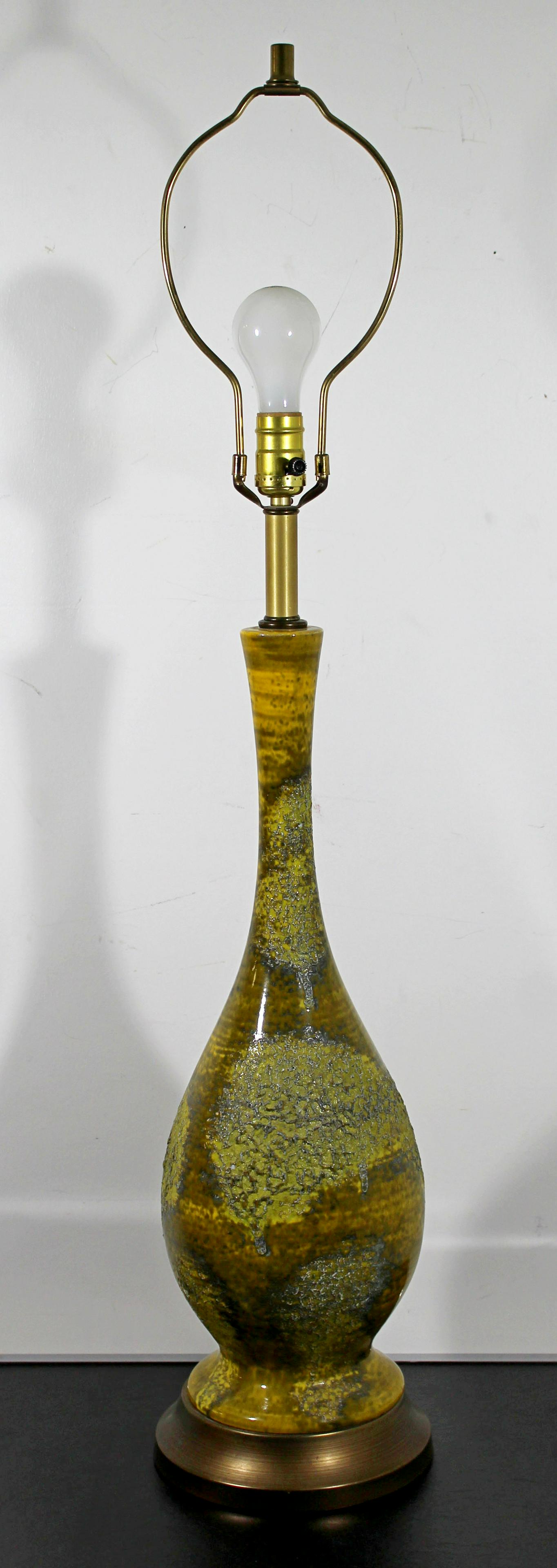 Helmut Bruchmann for Haeger Lava Drip Glaze Table Lamp: For your consideration is a magnificent table lamp, with a green, lava drip glaze, designed by ceramic engineer Helmut Bruchmann in the 1950s. In excellent condition. The dimensions are 8" Dia x 39.5"