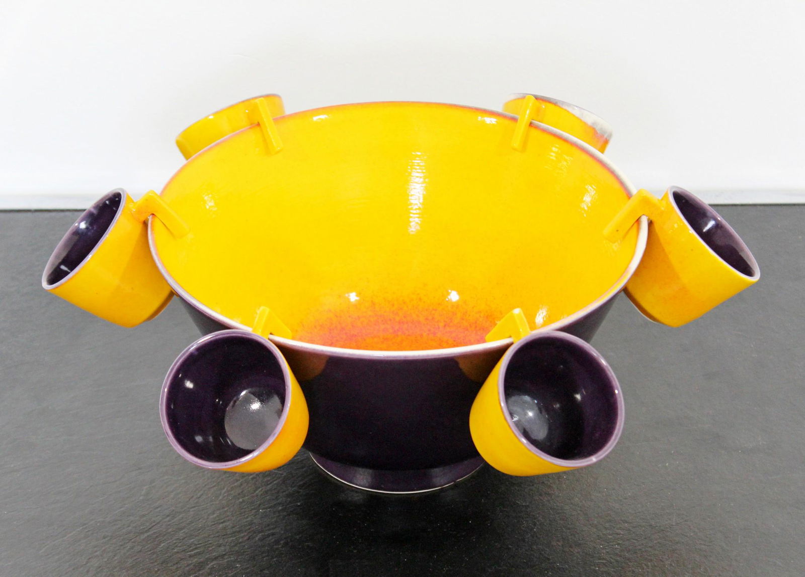 Modern Raymor Ceramic Bowl 6 Cups Italian 60s Orange: For your consideration is a stunning, yellow orange and purple, ceramic bowl and six matching cups, by Raymor Italy, circa the 1960s. In excellent condition. The dimensions of the bowl are 11.5" Dia x