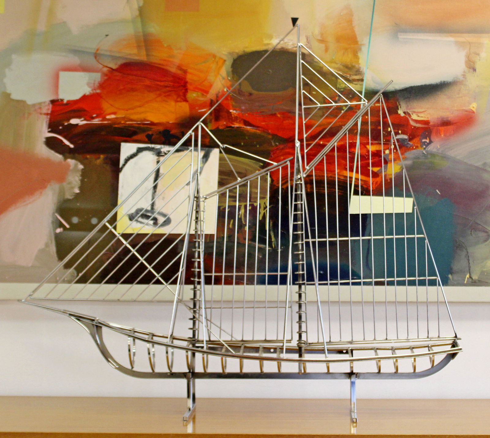 Modern Chrome Sailboat Sculpture Signed Curtis Jere: For your consideration is an incredible, chrome, table sculpture of a sailboat, signed and copy-written by Curtis Jere, circa the 1970s. In excellent condition. The dimensions are 47" W x 7" D x 41" H