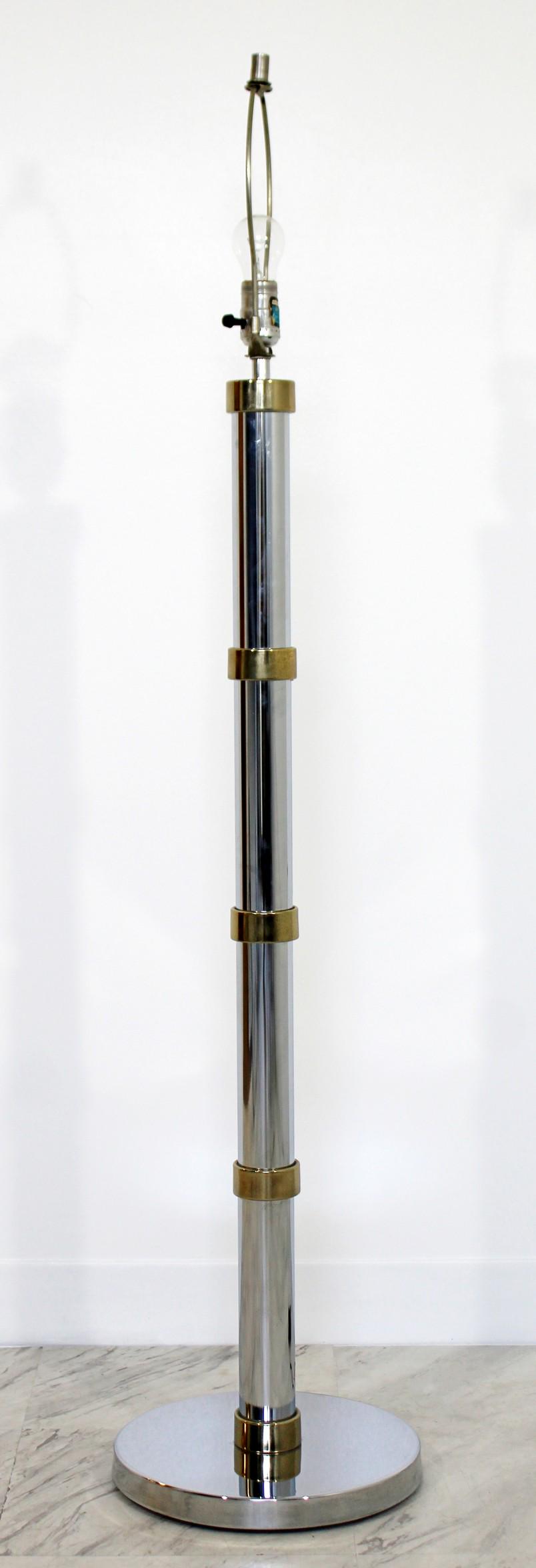 Mid Century Modern Sonneman Chrome Brass Floor Lamp: For your consideration is a fabulous, chrome and brass floor lamp, with original finial, by Robert Sonneman, circa the 1970s. In excellent condition. The dimensions are 11" Dia x 50" H.