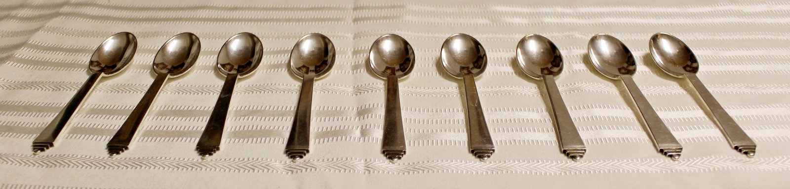 Georg Jensen Sterling Silver Pyramid Set 9 Coffee: For your consideration is a classic set of 9 Georg Jensen, sterling silver pyramid pattern coffee spoons, circa 1945. In excellent vintage condition. The dimensions are 5.5" L x 1.25" W.