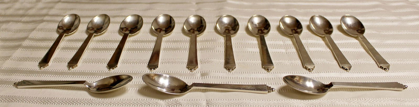 Georg Jensen Sterling Silver Pyramid Set 13 Tea Spoons: For your consideration is a fantastic set of 13 Georg Jensen, sterling silver pyramid pattern tea spoons, circa 1945. In excellent vintage condition. The dimensions are 5.5" L x 1.5" W.