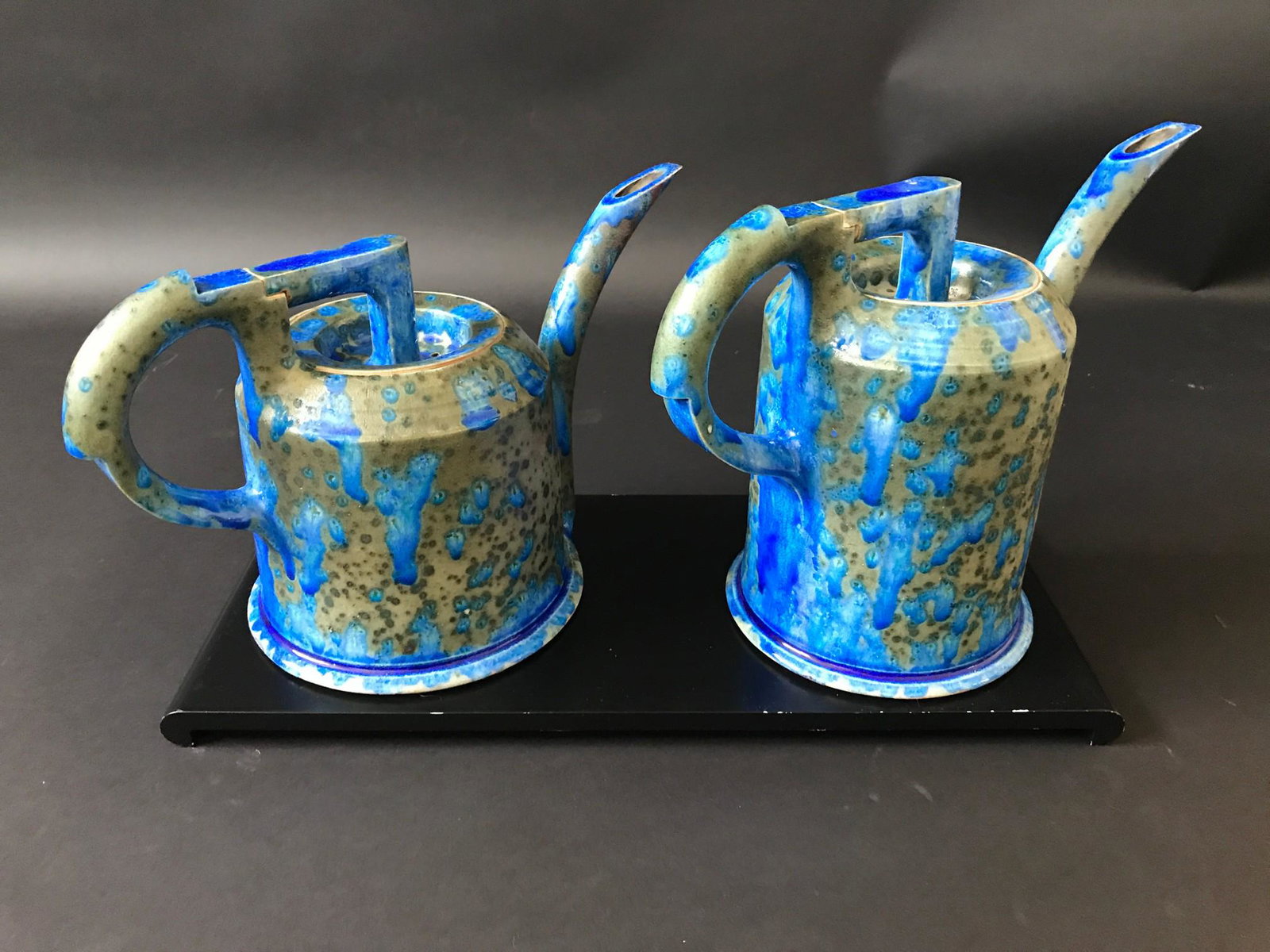 Pair of Ceramic Art Watering Pots by Anne Hirondelle: For your consideration is a pair of signed ceramic watering pots by Anne Hirondelle. In very good vintage condition, one of the handles has been damaged and professionally repaired. Dimensions are Lg 