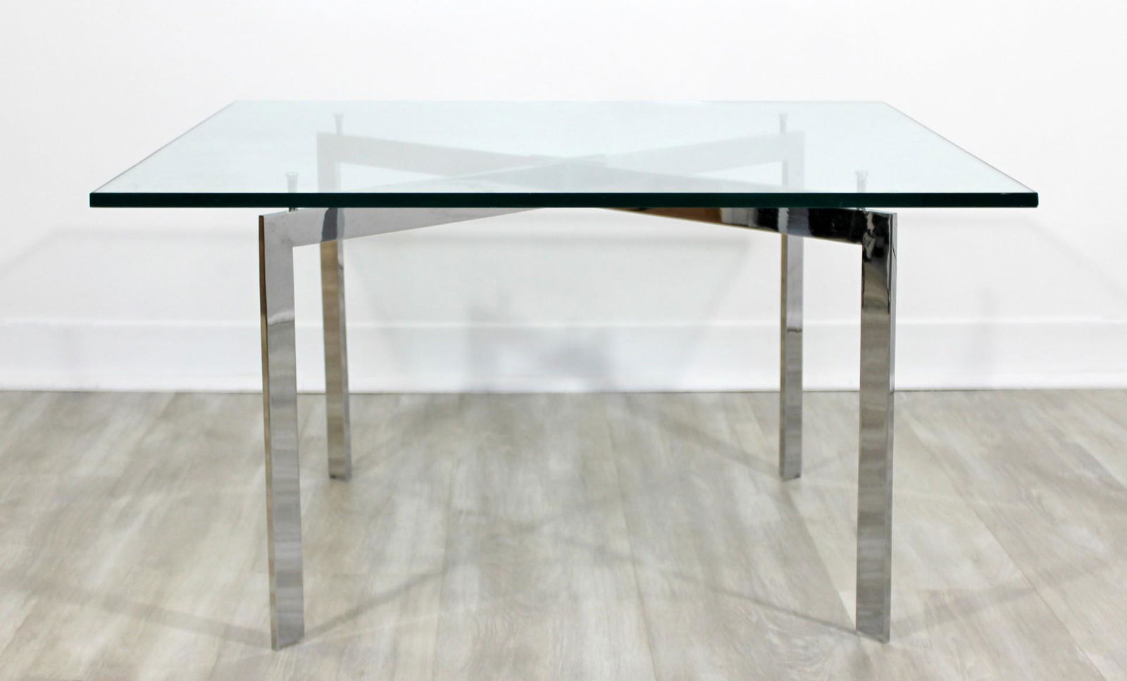 Bennett Geiger Square Chrome Glass Coffee Table X Base: For your consideration is a wonderful, square coffee table, made of chrome and with a glass top, by Ward Bennett for Geiger Furniture, circa the 1970s. In very good vintage condition. The dimensions a