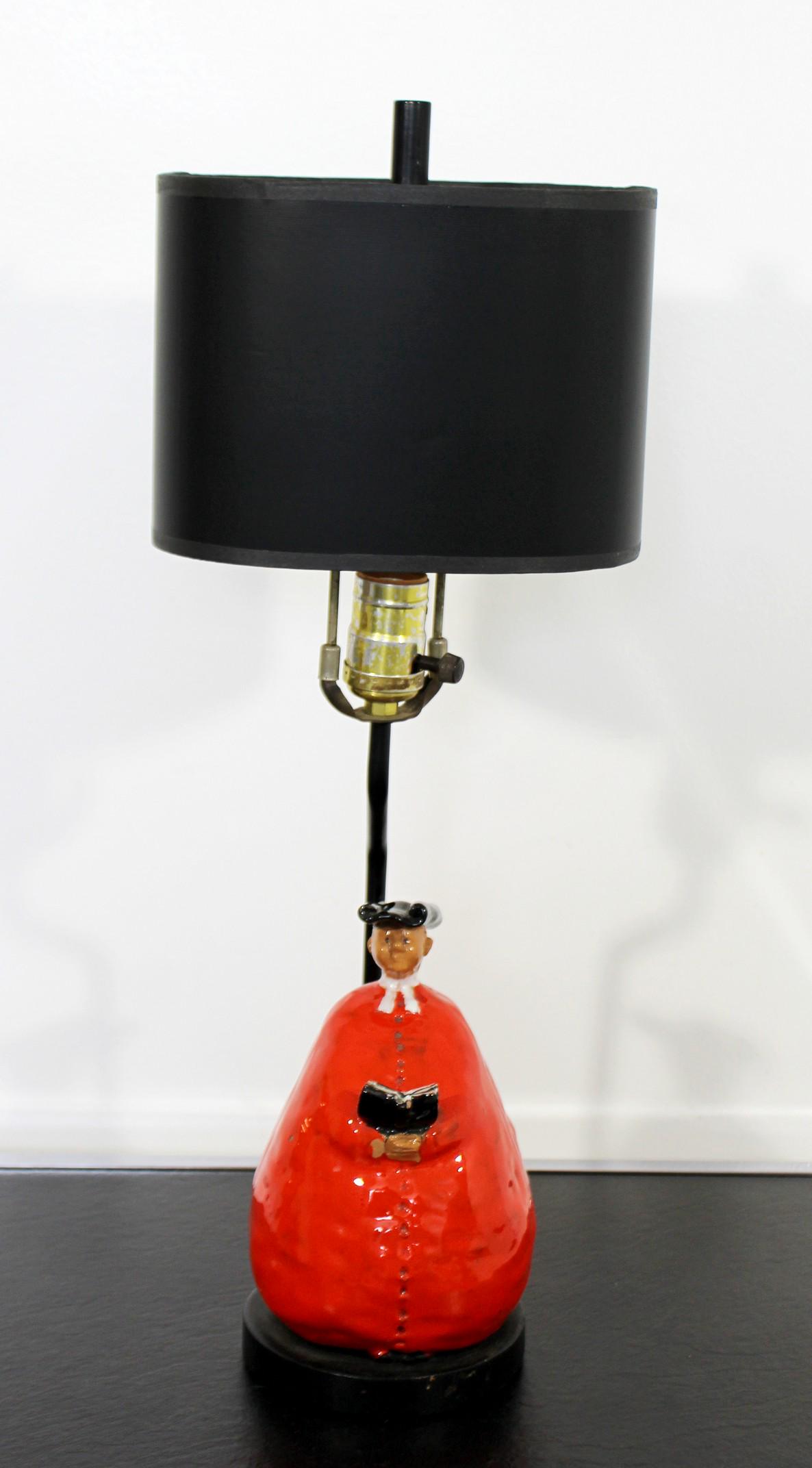 Abbot Monk Form Ceramic Lamp Italian 1950s Red & Black: For your consideration is an amazing and rare, Italian ceramic table lamp, comprised of Abbot Monk Figurines in red, black and white glaze, circa the 1950s. With wrought iron poles and wood bases. In 