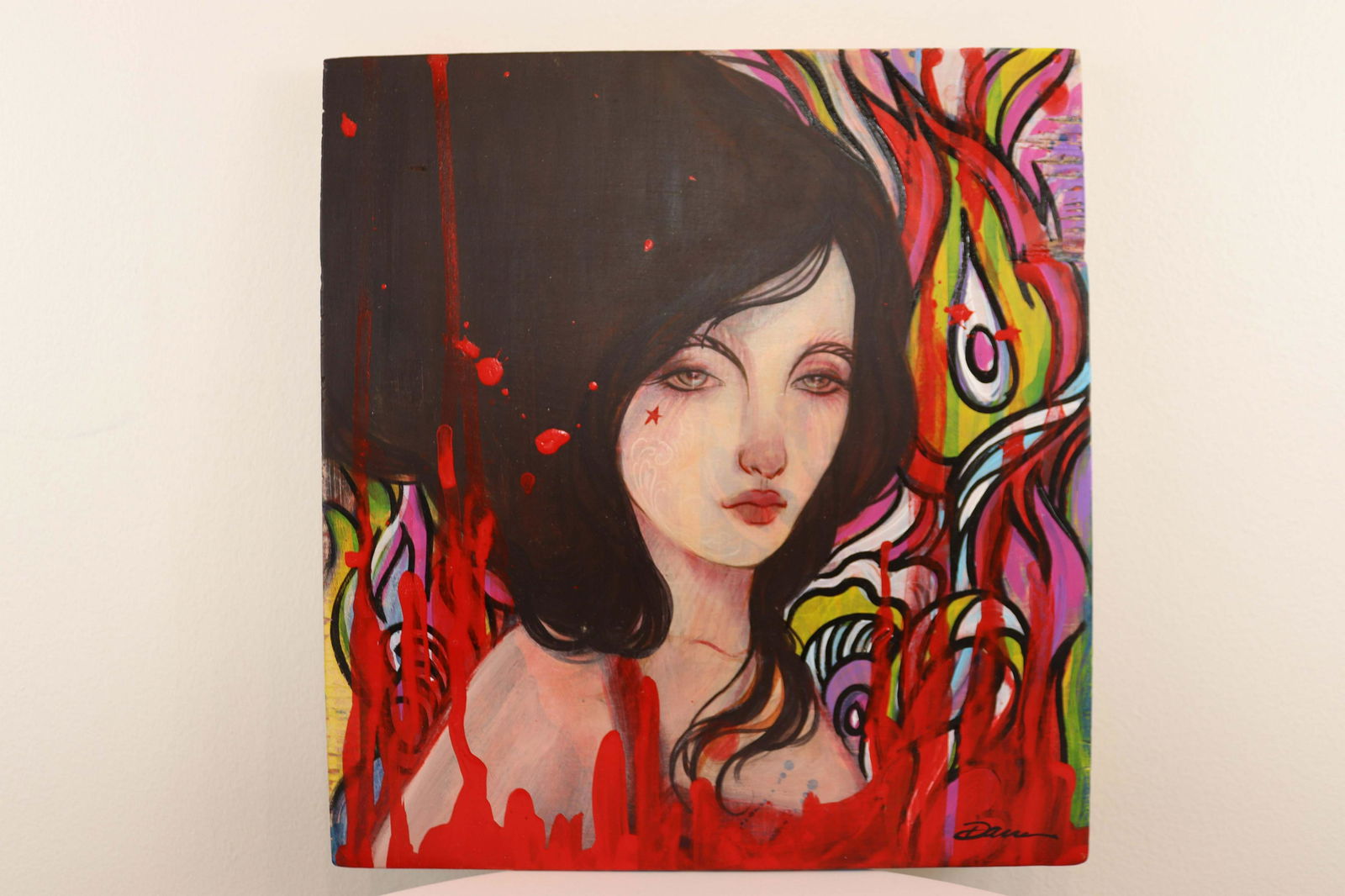 Lara Dann Red Star Acrylic Painting on Board 2010: A radiant acrylic painting on canvas, titled Red Star, depicting a strong yet graceful feminine portrait, by contemporary artist Lara Dann. Signed on front bottom right and titled/signed/dated on vers