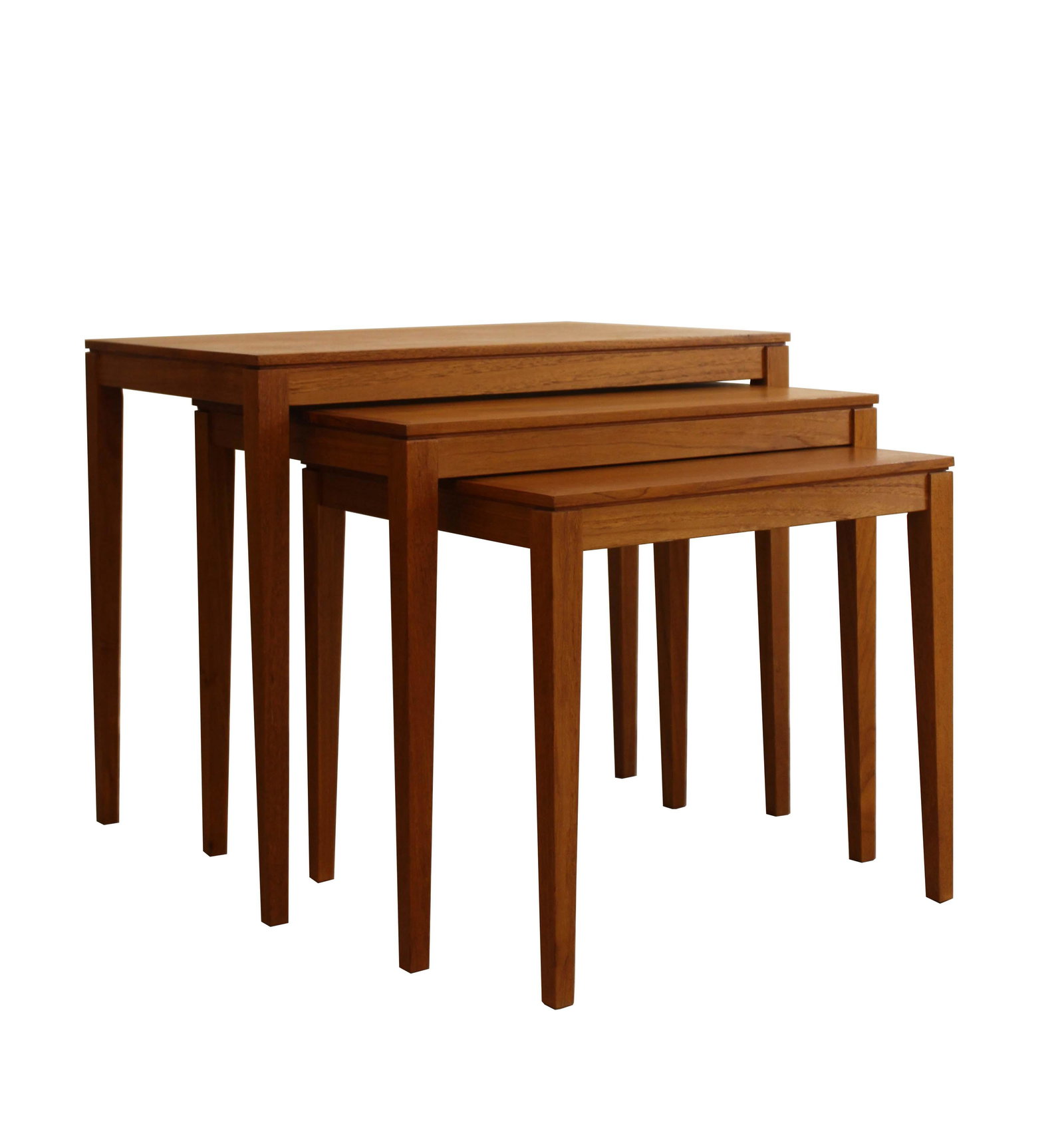 Mid Century Modern Danish Set of 3 Nesting Tables: This set of 3 Danish modern nesting tables is finely constructed with bullnose mitered edges is made of solid teak, recently oiled. Each table rests conveniently with each other, making for versatile 