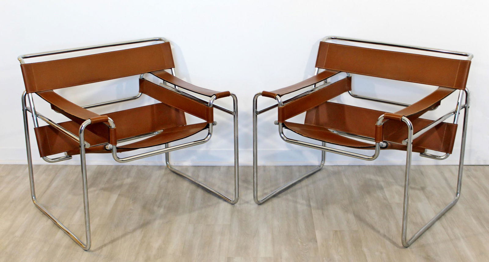 Pair of Original Vintage Marcel Breuer Wassily Chairs Cognac Leather: A pair of original vintage Wassily chairs in beautiful cognac leather. In great condition. Patina is appropriate to the age and use of these chairs. Dimensions: 31"w x 25.75"d x 28.5"h Arm Height: 20.