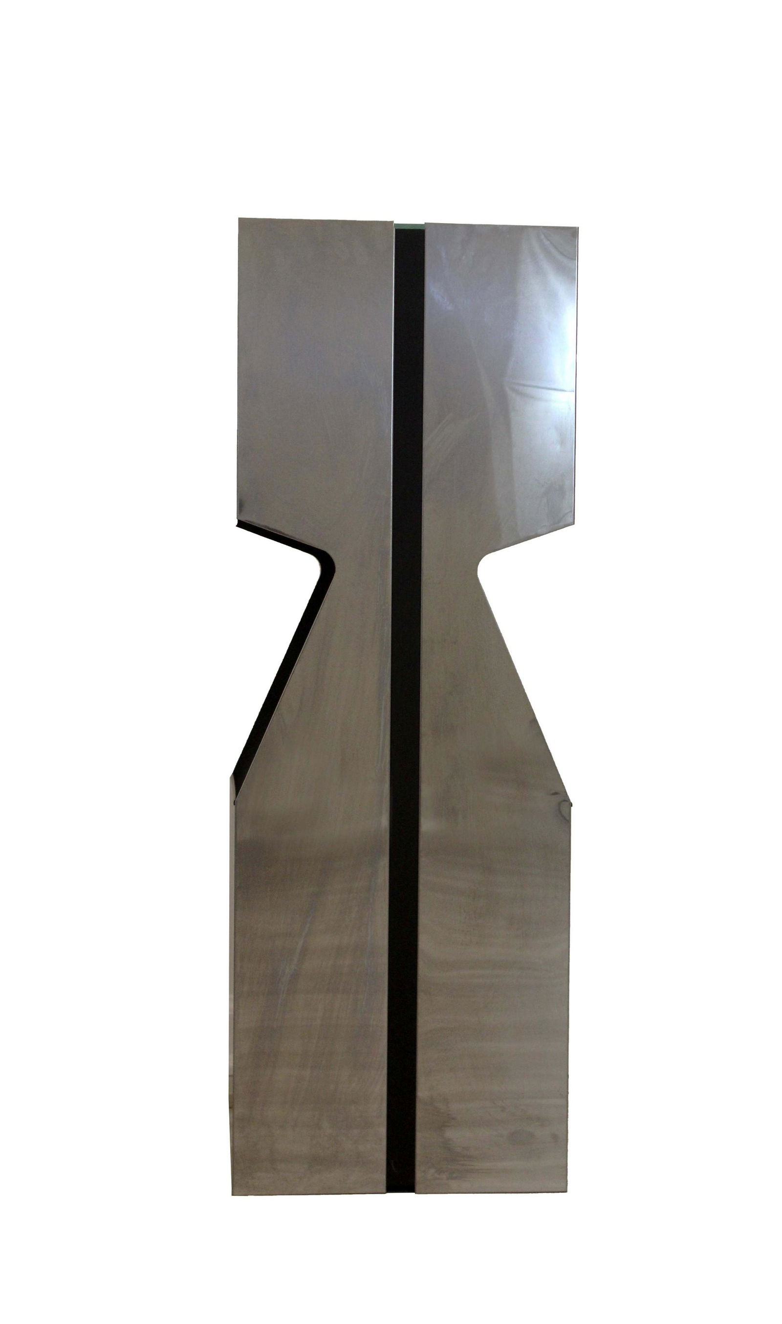 Neal Small For Kovacs Chrome Illuminated Pedestal Light & Magazine Rack: An original illuminated Neal Small pedestal manufactured by George Kovacs in the 1970s. The pedestal is constructed from chromed steel sheet metal and features a frosted glass top, matte black interio